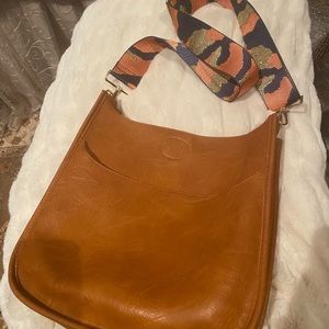 Tan vegan leather bag with detachable strap brand is Social Threads